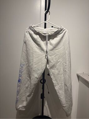 TNA Cream Sweatpants with Blue Side Logo Script